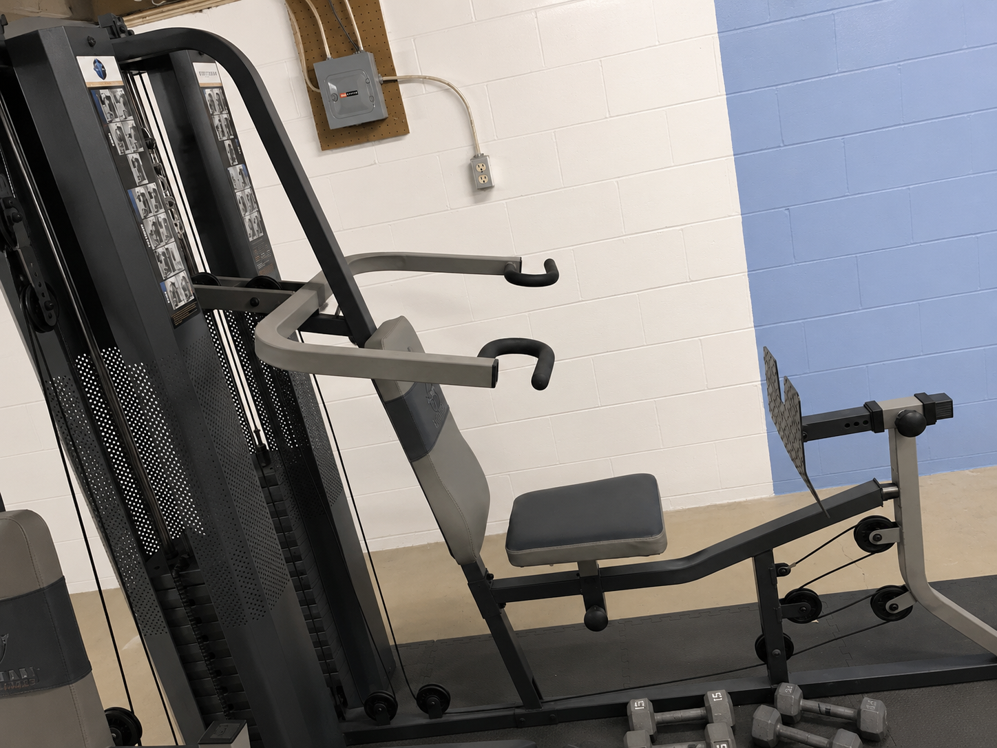 Home gym weight-stack equipment assembled in a workout area